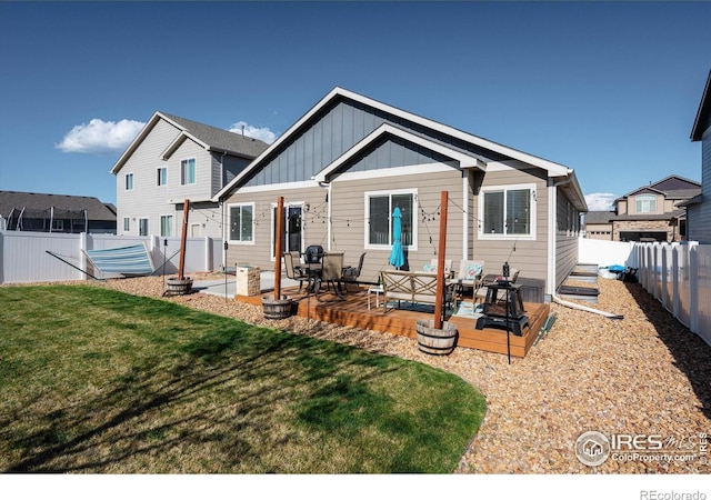2433 Tabor St, Berthoud, CO 80513 - rear view of house featuring board and batten siding and an outdoor living space
