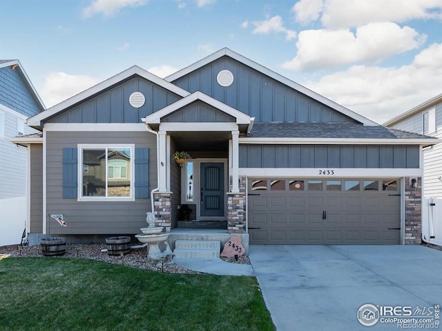2433 Tabor St, Berthoud, CO 80513 - craftsman-style house with board and batten siding, a garage, driveway, a front lawn, and a shingled roof