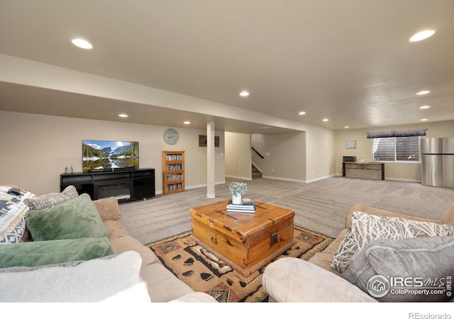 2433 Tabor St, Berthoud, CO 80513 - carpeted living room with recessed lighting, stairs, and baseboards
