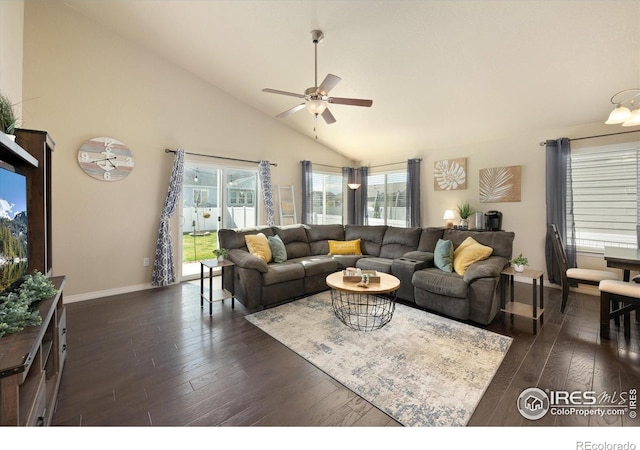2433 Tabor St, Berthoud, CO 80513 - living area with dark wood-style flooring, a ceiling fan, high vaulted ceiling, and baseboards
