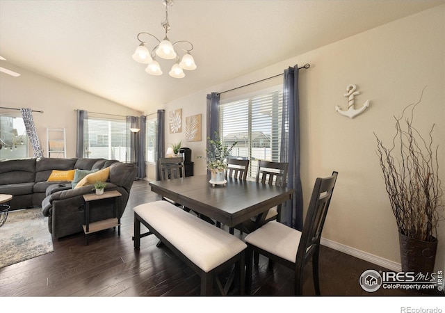 2433 Tabor St, Berthoud, CO 80513 - dining space with a chandelier, lofted ceiling, plenty of natural light, dark wood-style floors, and baseboards
