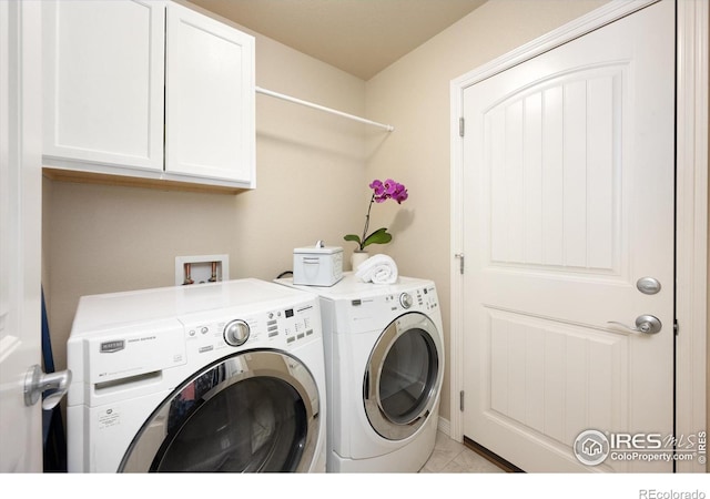 2433 Tabor St, Berthoud, CO 80513 - laundry area featuring washer and clothes dryer and cabinet space