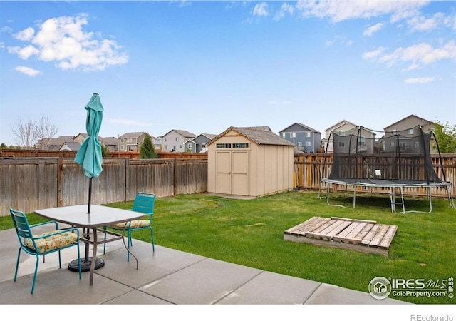 1484 Moraine Valley Dr, Severance, CO 80550 - view of yard featuring a patio, a residential view, a fenced backyard, and a trampoline