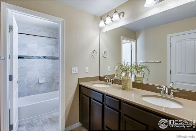 1484 Moraine Valley Dr, Severance, CO 80550 - full bathroom with double vanity, a sink, and shower / bathtub combination