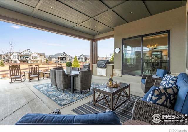 view of patio / terrace with a residential view, outdoor dining space, area for grilling, and outdoor lounge area