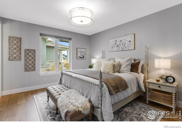 bedroom with baseboards and light wood-style floors