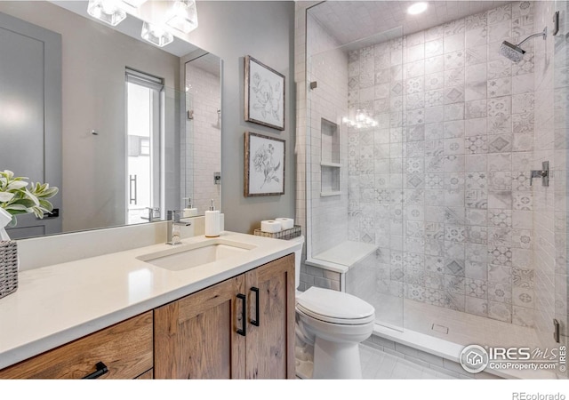 full bathroom with vanity, toilet, a stall shower, and a notable chandelier