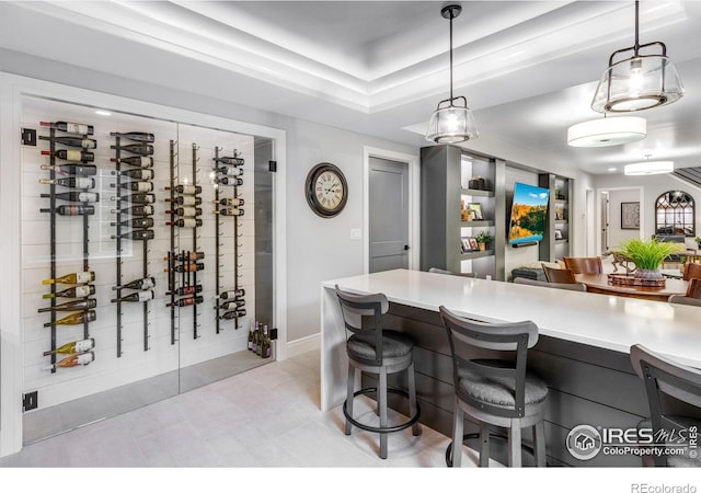 wine cellar featuring baseboards and light tile patterned floors