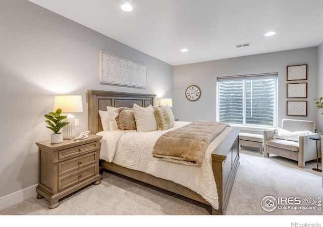 bedroom featuring recessed lighting, visible vents, and light carpet