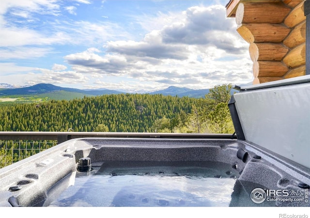 4 Dill Pickle Pl, Black Hawk, CO 80422 - exterior view of a hot tub, a mountain view, and a view of trees