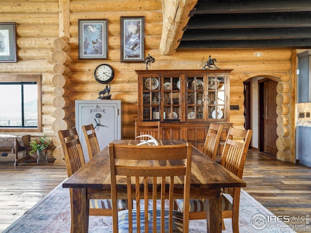 4 Dill Pickle Pl, Black Hawk, CO 80422 - dining space with arched walkways, log walls, and hardwood / wood-style floors