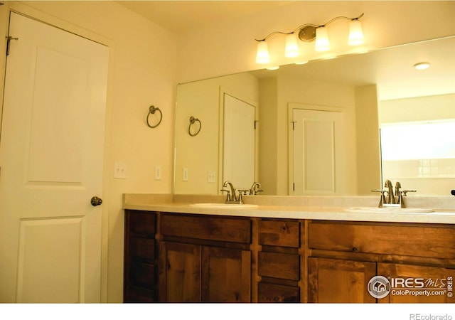 8710 8th St, Greeley, CO 80634 - bathroom featuring double vanity