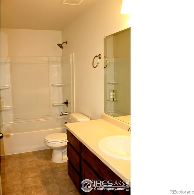 8710 8th St, Greeley, CO 80634 - full bathroom with vanity, washtub / shower combination, and tile patterned floors