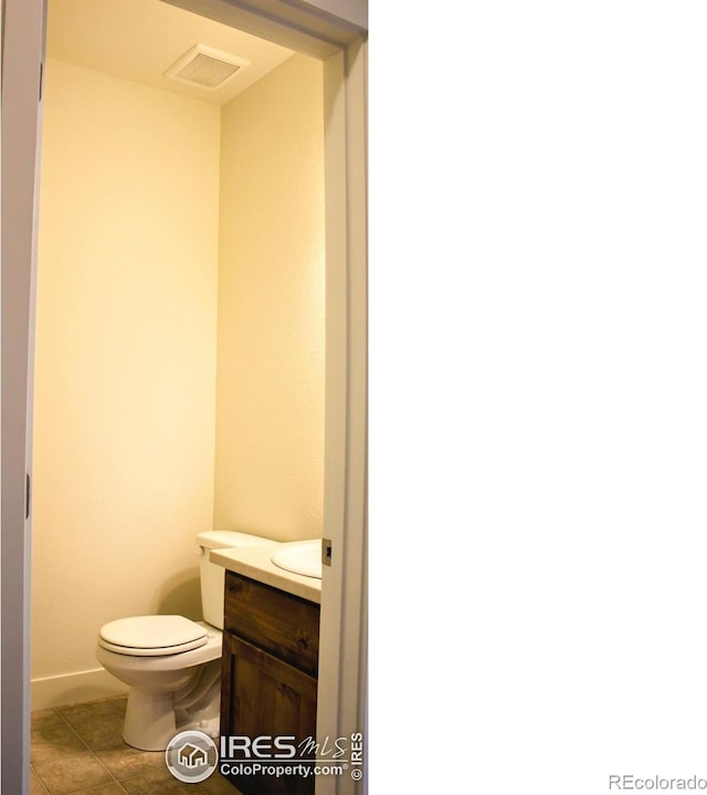 8710 8th St, Greeley, CO 80634 - half bathroom featuring vanity and toilet