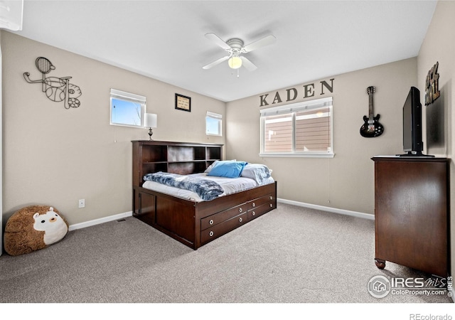 bedroom with baseboards, ceiling fan, and carpet