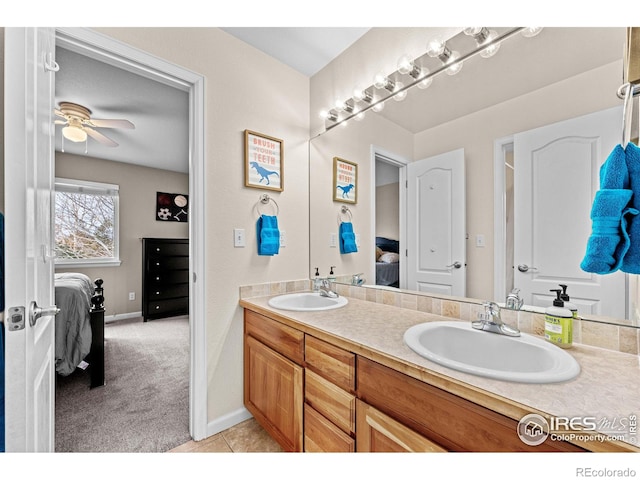 ensuite bathroom featuring double vanity, a sink, and ensuite bathroom