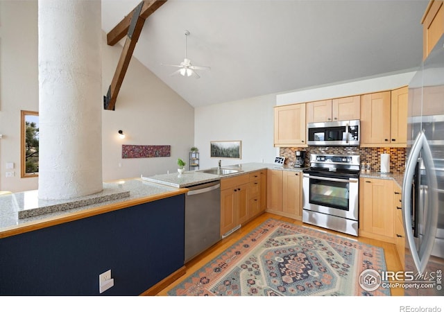 810 Manhead Mountain Dr, Livermore, CO 80536 - kitchen with appliances with stainless steel finishes, light brown cabinets, light wood-style floors, high vaulted ceiling, and ceiling fan