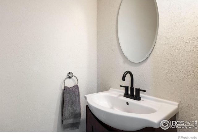810 Manhead Mountain Dr, Livermore, CO 80536 - bathroom with vanity and a textured wall