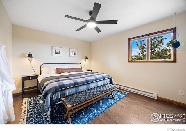 810 Manhead Mountain Dr, Livermore, CO 80536 - bedroom with a baseboard radiator, wood finished floors, baseboards, and a ceiling fan