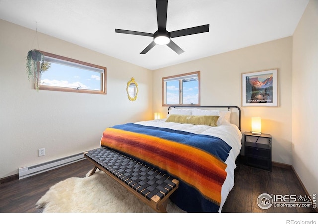 810 Manhead Mountain Dr, Livermore, CO 80536 - bedroom featuring a baseboard radiator, wood finished floors, baseboards, and ceiling fan