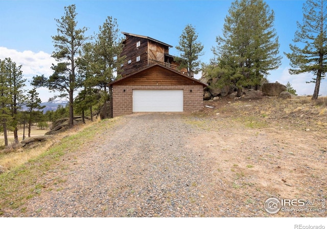 810 Manhead Mountain Dr, Livermore, CO 80536 - garage with gravel driveway