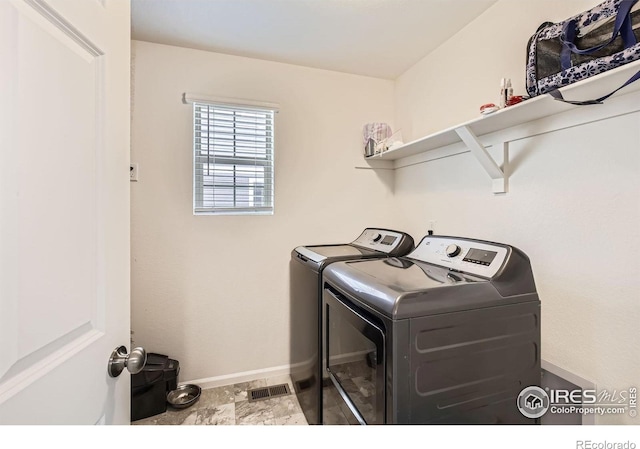 3506 Valleywood Ct, Johnstown, CO 80534 - laundry area with baseboards, washer and dryer, and laundry area