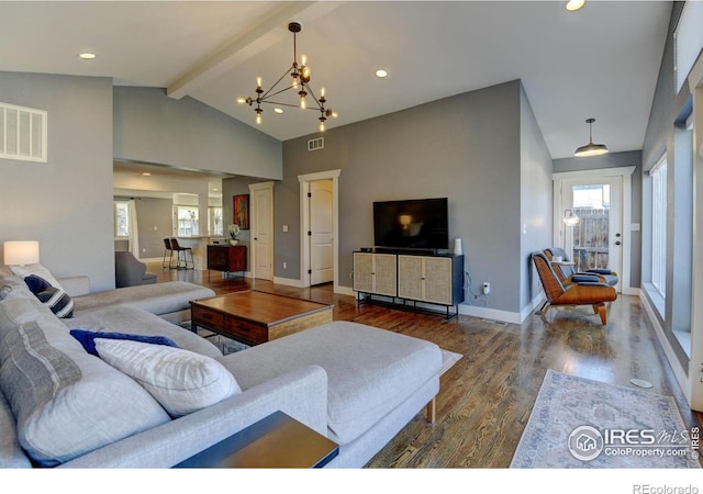 living area with wood finished floors, a wealth of natural light, vaulted ceiling with beams, and an inviting chandelier