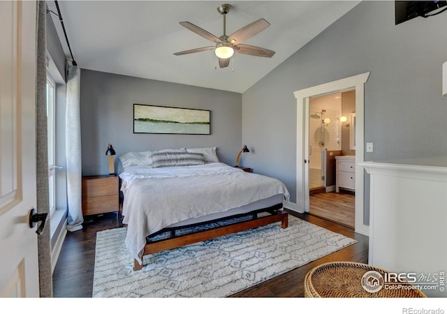bedroom featuring vaulted ceiling, baseboards, a ceiling fan, wood finished floors, and connected bathroom
