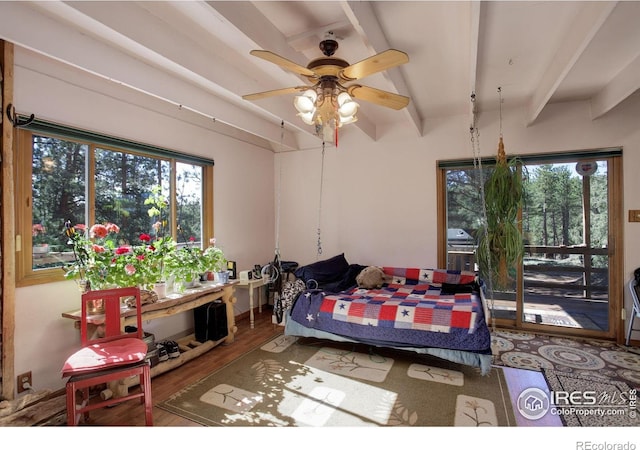 147 Cedar Dr, Lyons, CO 80540 - bedroom with multiple windows, beam ceiling, and wood finished floors