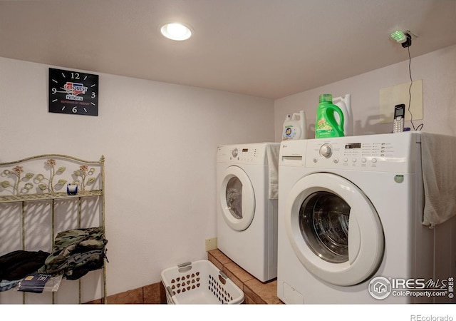 147 Cedar Dr, Lyons, CO 80540 - washroom with washing machine and dryer and light tile patterned floors