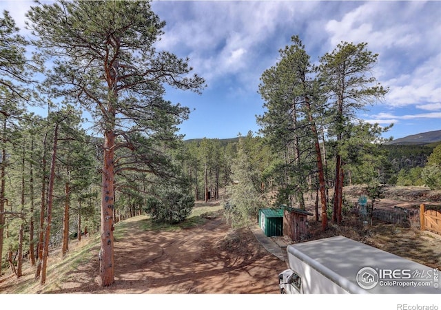 147 Cedar Dr, Lyons, CO 80540 - view of yard with a view of trees