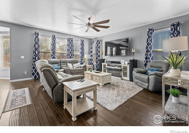 338 Mt Wilson St, Brighton, CO 80601 - living room featuring a ceiling fan and dark wood-style floors
