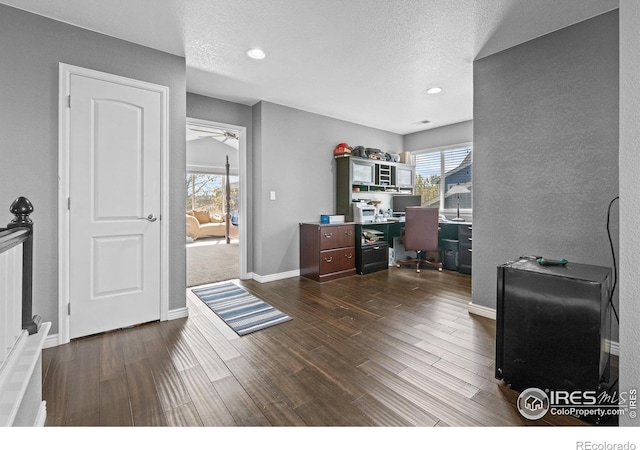 338 Mt Wilson St, Brighton, CO 80601 - office space featuring dark wood-style floors, ceiling fan, recessed lighting, and a textured ceiling