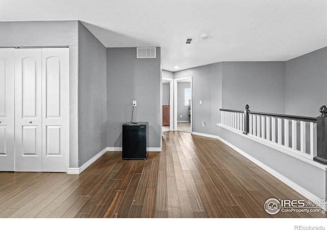 338 Mt Wilson St, Brighton, CO 80601 - unfurnished living room featuring dark wood-style flooring and baseboards