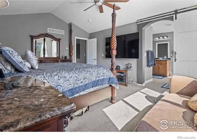 338 Mt Wilson St, Brighton, CO 80601 - bedroom featuring carpet floors, vaulted ceiling, arched walkways, a ceiling fan, and connected bathroom