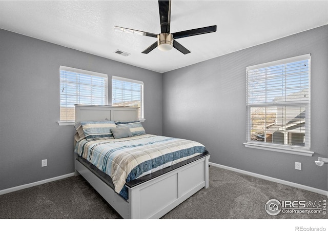 338 Mt Wilson St, Brighton, CO 80601 - bedroom featuring dark colored carpet and ceiling fan