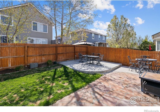 338 Mt Wilson St, Brighton, CO 80601 - fenced backyard with a patio and outdoor dining space