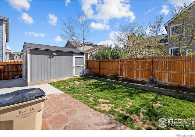 338 Mt Wilson St, Brighton, CO 80601 - fenced backyard featuring a patio and a shed