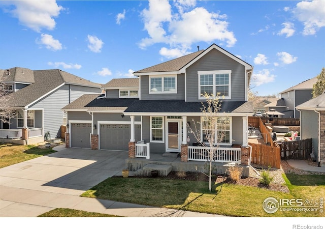 338 Mt Wilson St, Brighton, CO 80601 - view of front facade with covered porch, driveway, an attached garage, roof with shingles, and a residential view