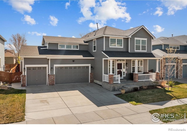 338 Mt Wilson St, Brighton, CO 80601 - view of front facade featuring a porch, concrete driveway, a garage, and brick siding