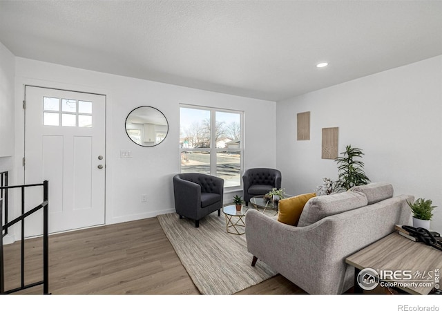 4752 E 108th Pl, Thornton, CO 80233 - living room featuring baseboards, wood finished floors, recessed lighting, and a healthy amount of sunlight