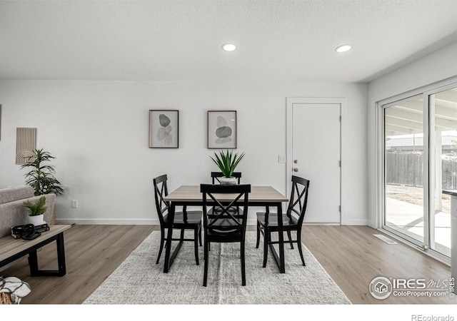 4752 E 108th Pl, Thornton, CO 80233 - dining area featuring wood finished floors, a wealth of natural light, and recessed lighting