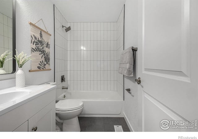 4752 E 108th Pl, Thornton, CO 80233 - bathroom featuring tile patterned floors, vanity, bathtub / shower combination, a textured wall, and toilet