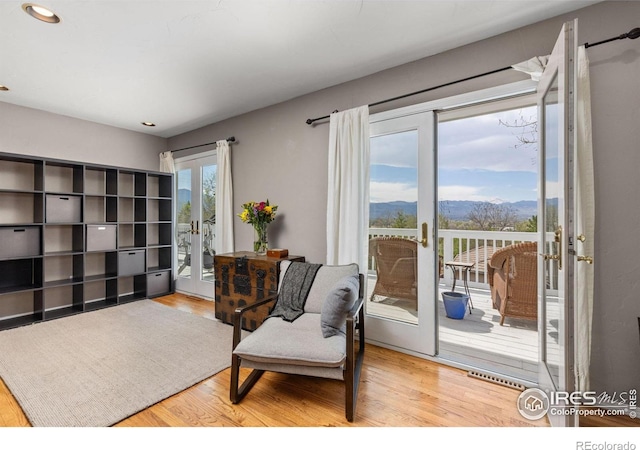 1247 Westview Dr, Boulder, CO 80303 - sitting room with recessed lighting, french doors, a mountain view, and wood finished floors