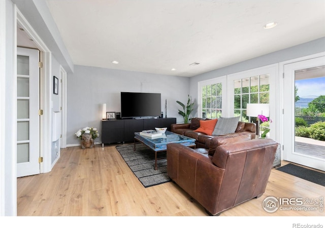 1247 Westview Dr, Boulder, CO 80303 - living room featuring recessed lighting, baseboards, wood finished floors, and visible vents