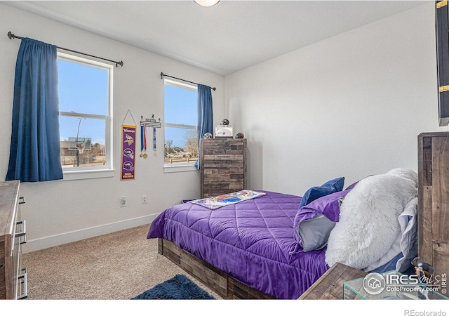 bedroom with carpet and baseboards
