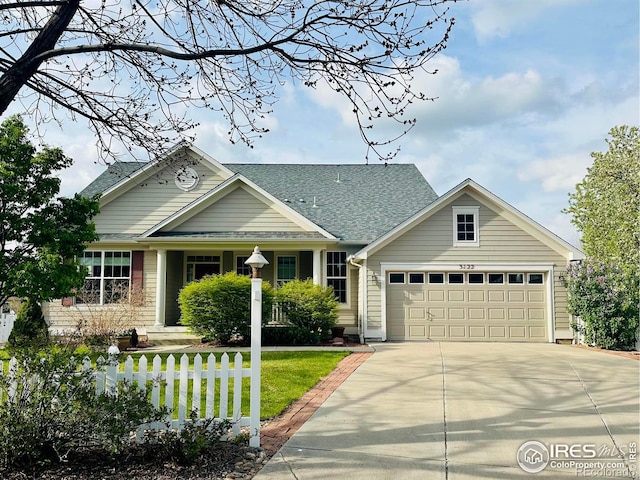 3122 Notabon Ct, Lafayette, CO 80026 - view of front of home with an attached garage, driveway, a shingled roof, and a front lawn