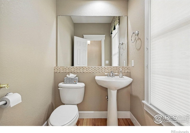 3122 Notabon Ct, Lafayette, CO 80026 - half bathroom featuring wood finished floors and toilet