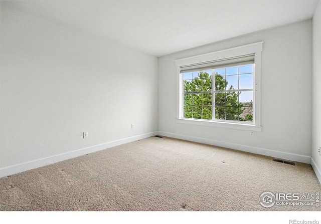 3122 Notabon Ct, Lafayette, CO 80026 - spare room featuring baseboards, carpet floors, and visible vents
