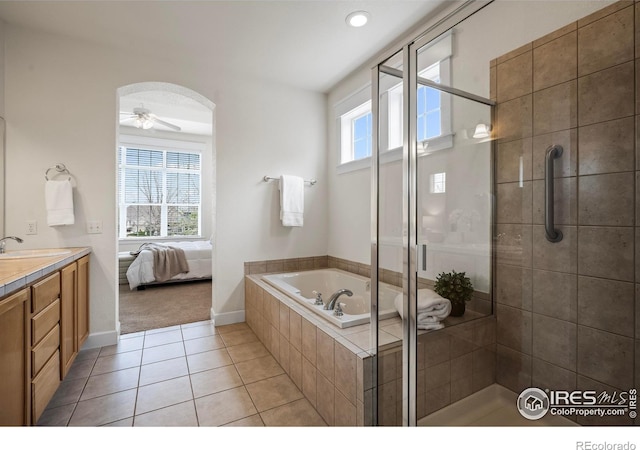 3122 Notabon Ct, Lafayette, CO 80026 - bathroom with vanity, ceiling fan, a bath, tile patterned floors, and a stall shower